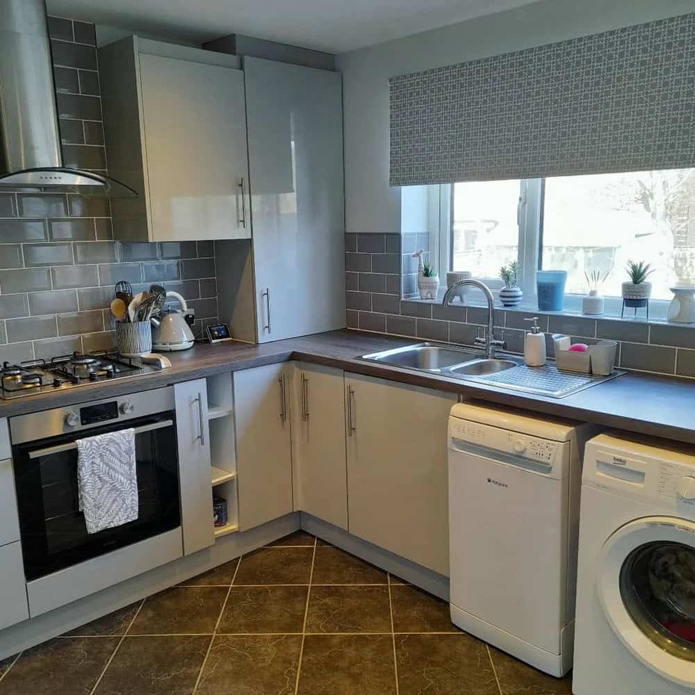 kitchens with gray backsplash