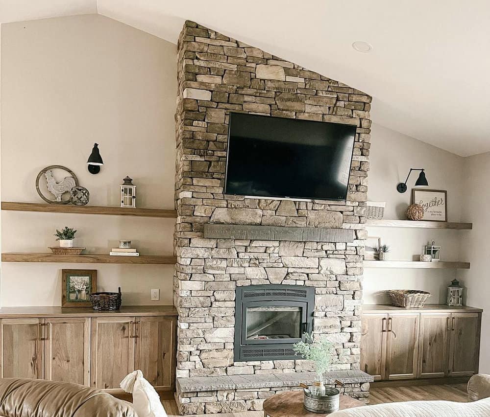 stone fireplace with bookshelves on each side