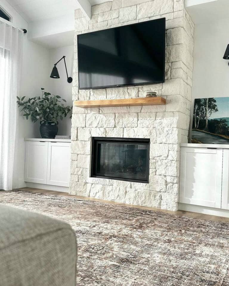 floor to ceiling stone fireplace with tv feature