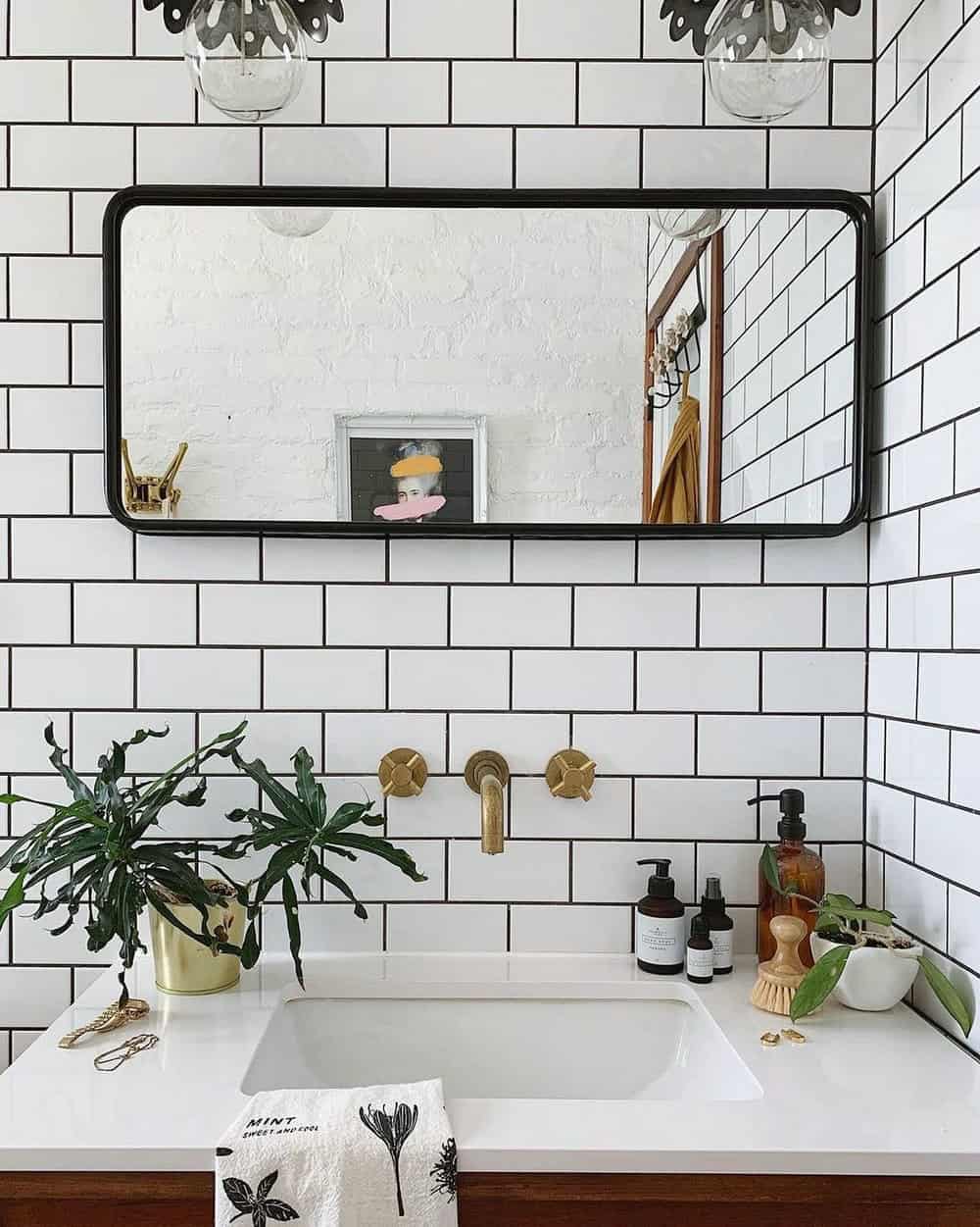 bathroom white subway tile black grout