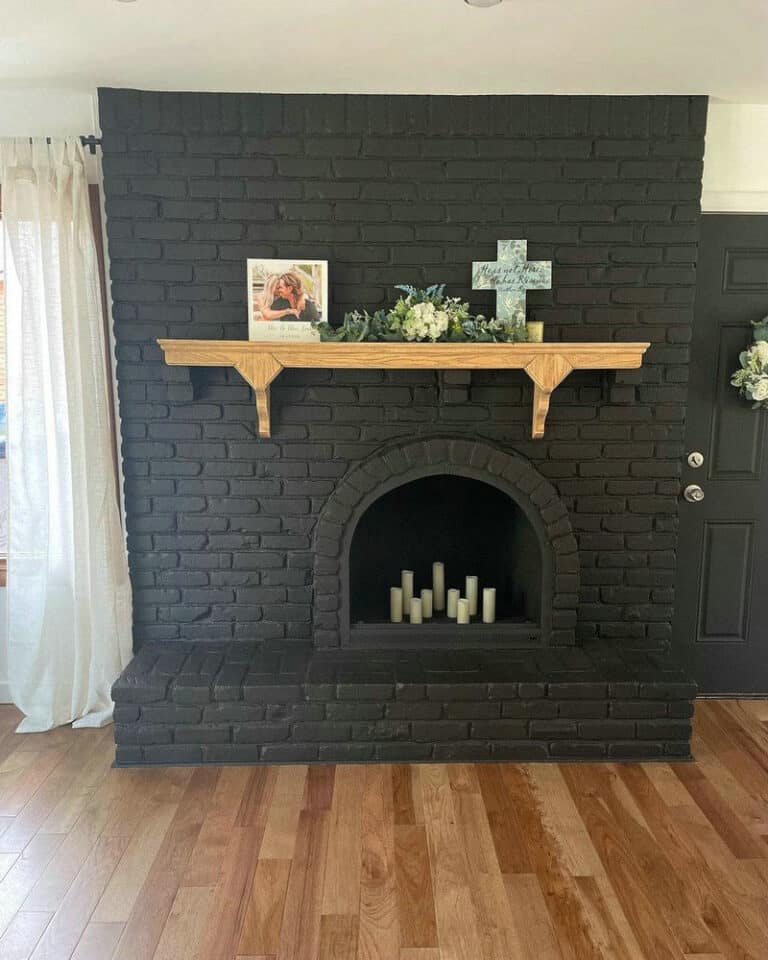 dark painted brick fireplace feature