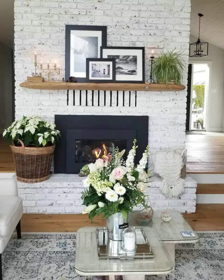 white brick fireplace with black mantel feature