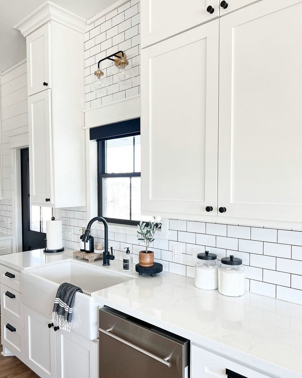 white tile black grout bathroom