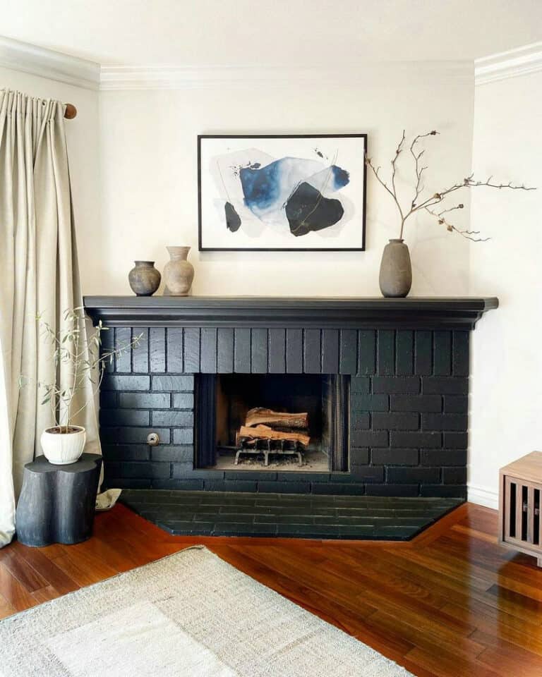 black subway tile fireplace feature