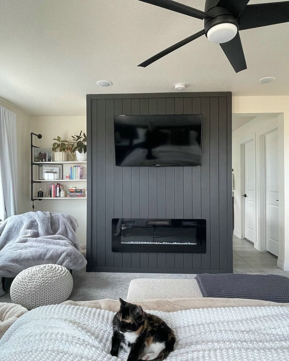 black shiplap wall fireplace