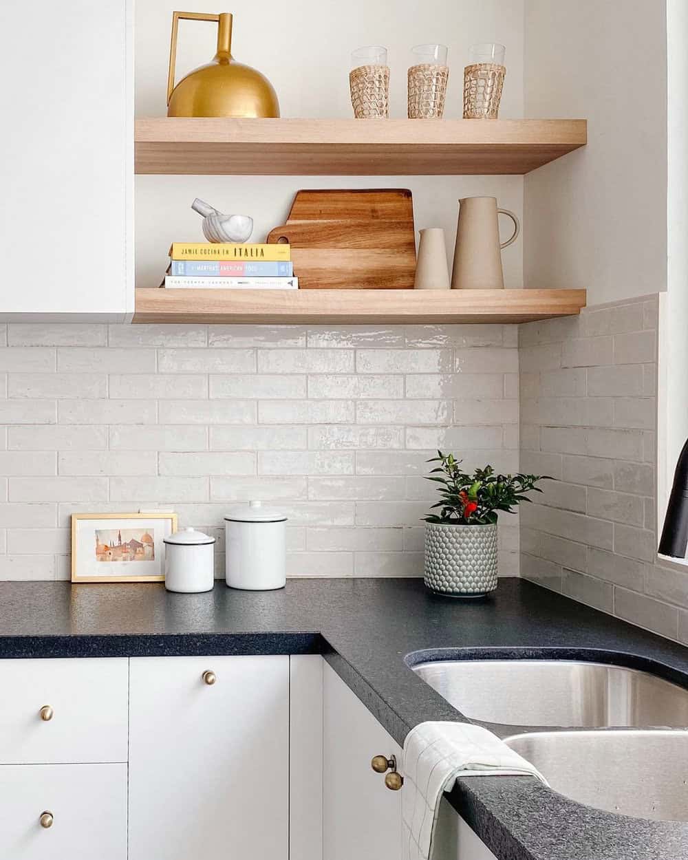 white backsplash with black countertops