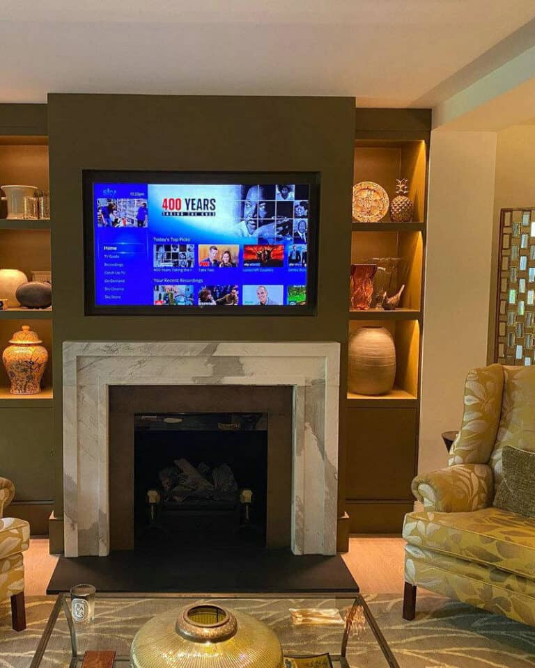 modern fireplace with tv above feature