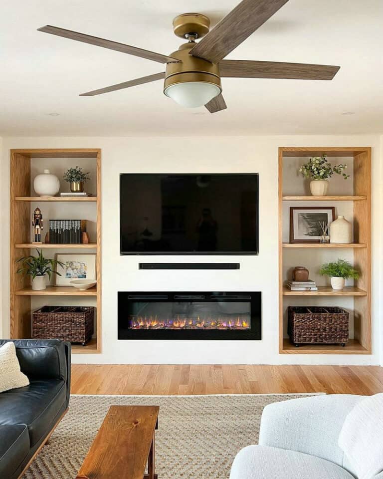 electric fireplace with tv mounted above feature