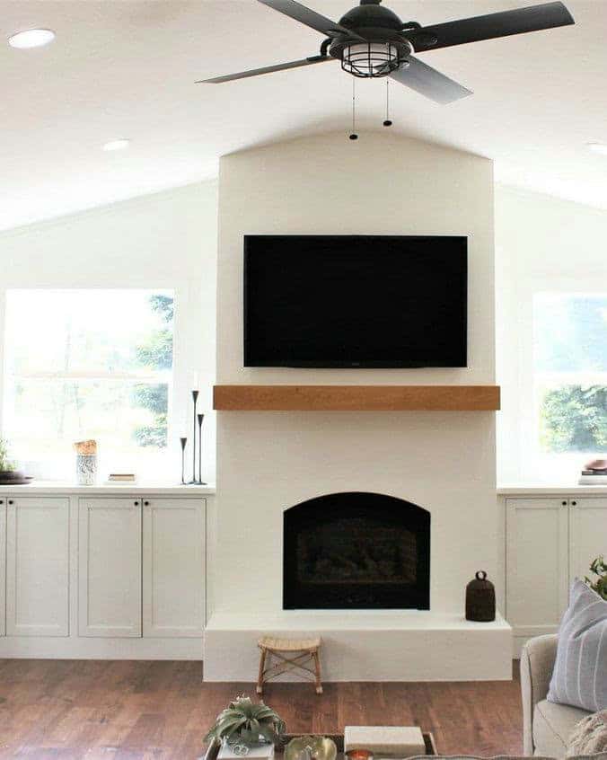 plaster fireplace with wood mantel feature