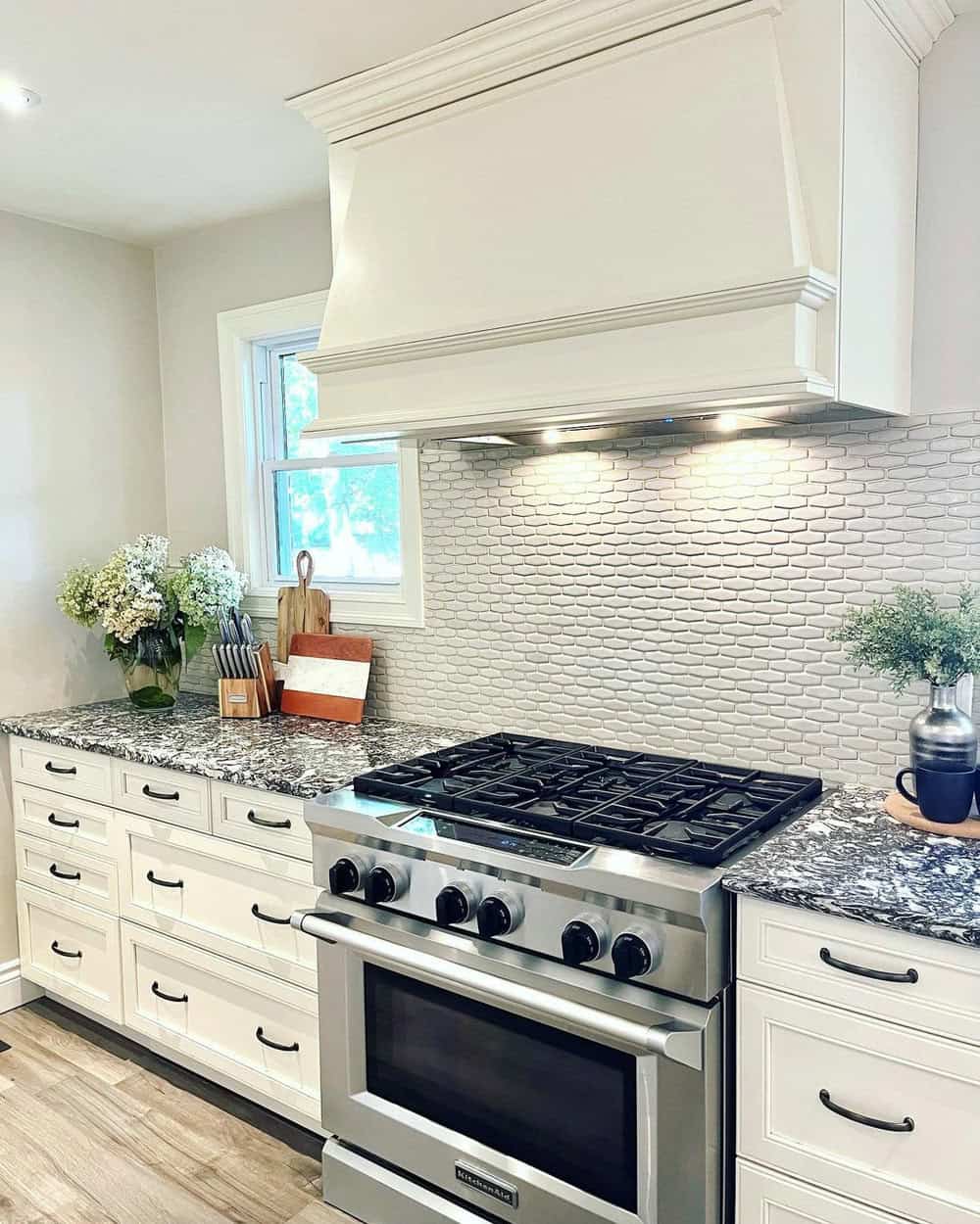 white backsplash with accent tile