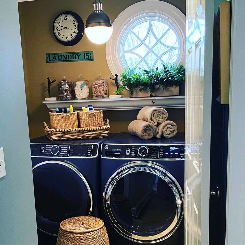 laundry room with blue washer and dryer