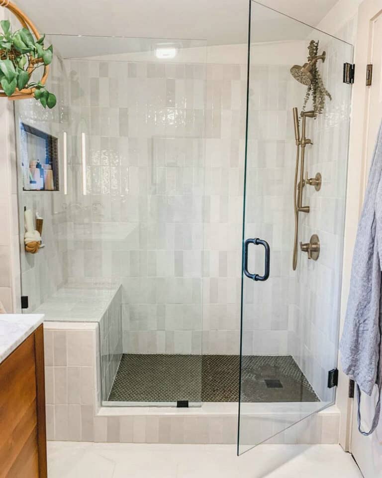 white subway tile shower with niche feature