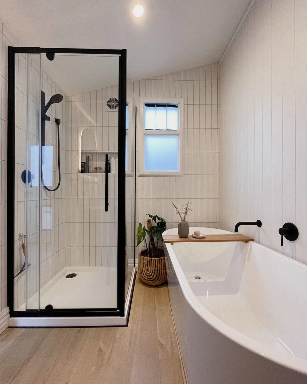 vertical white subway tile shower