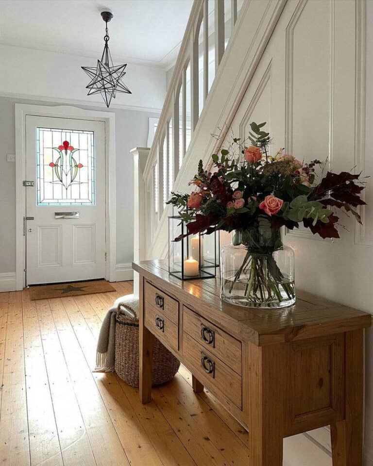 tile foyer with wood floors feature