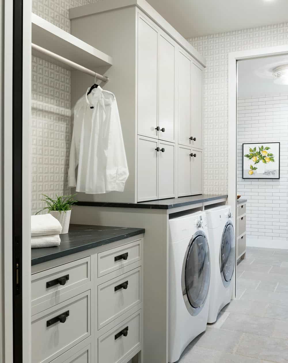 laundry room with black washer and dryer