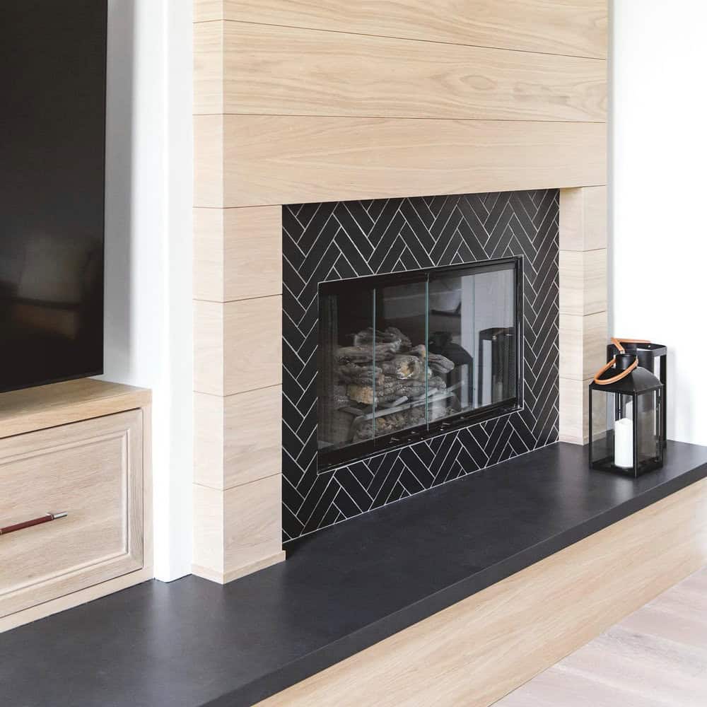 black herringbone tile fireplace