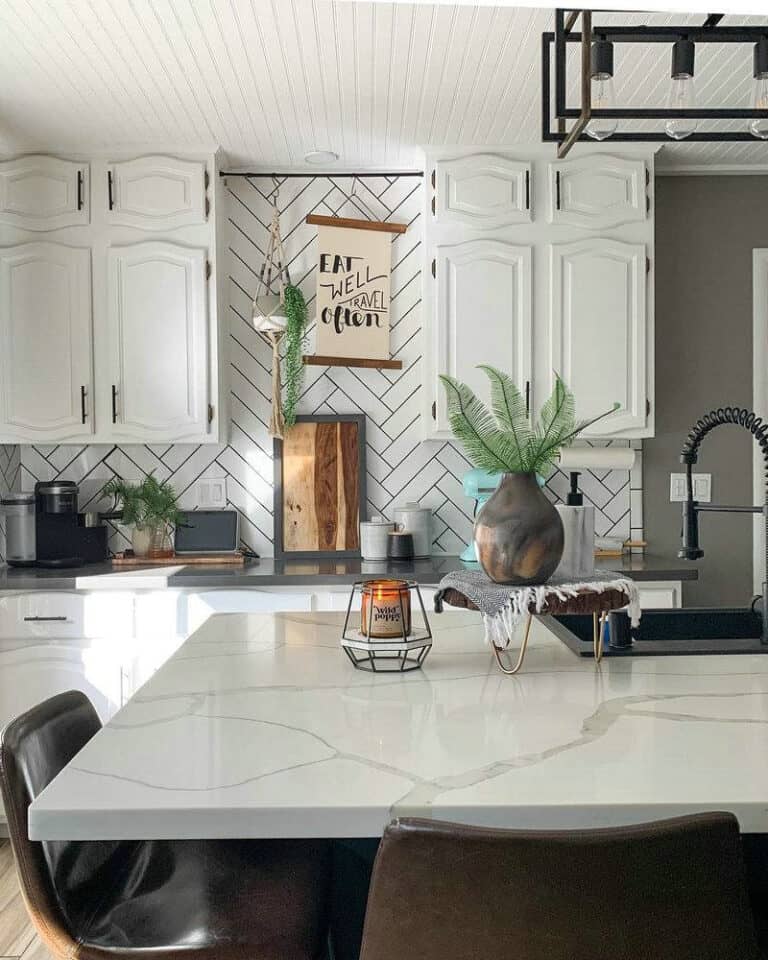 white herringbone tile with black grout feature