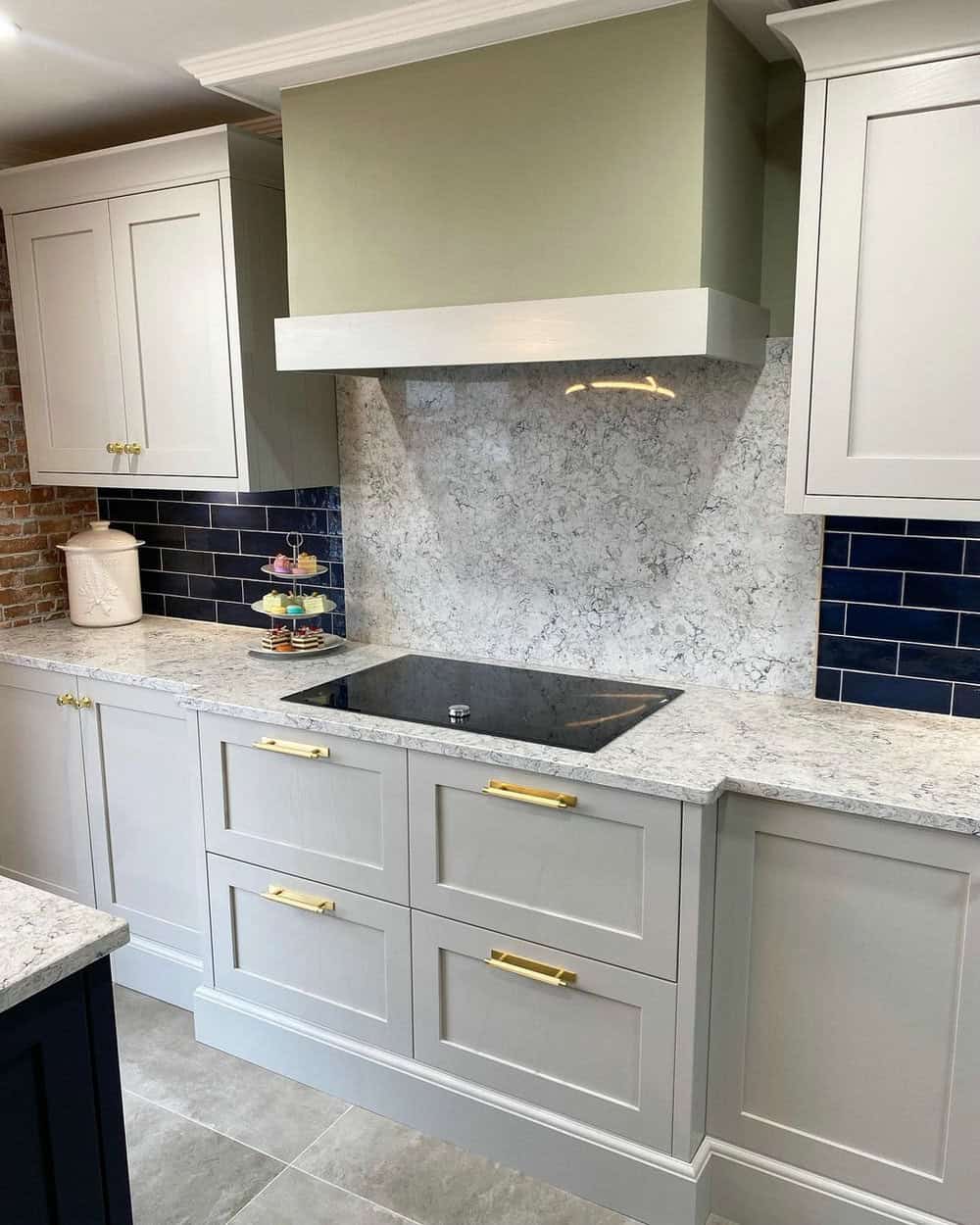 grey cabinets with black appliances