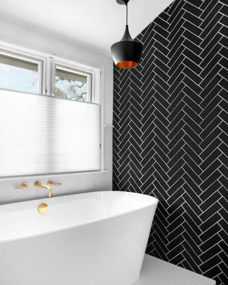 black herringbone tile shower feature