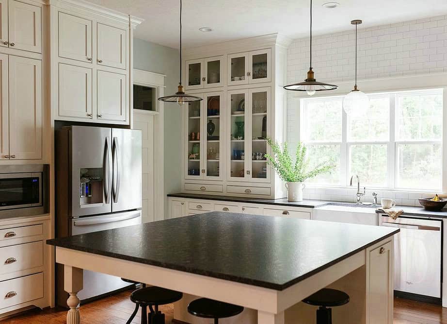 backsplash for black granite countertops and white cabinets