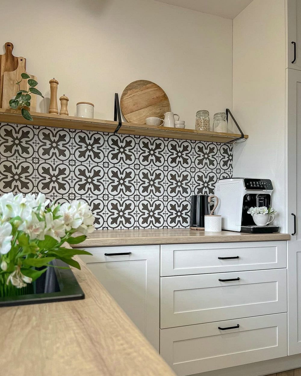 backsplash in kitchen with white cabinets