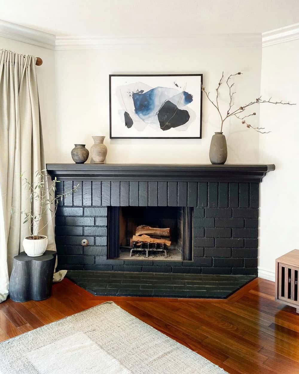 black subway tile fireplace