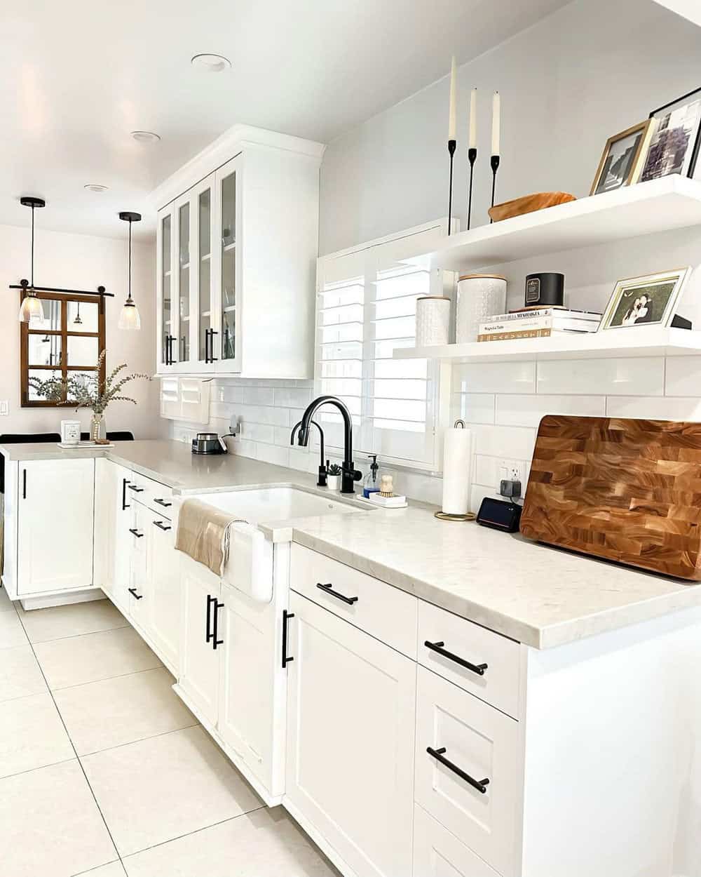 Custom white shaker cabinets are a perfect fit above white tile floors