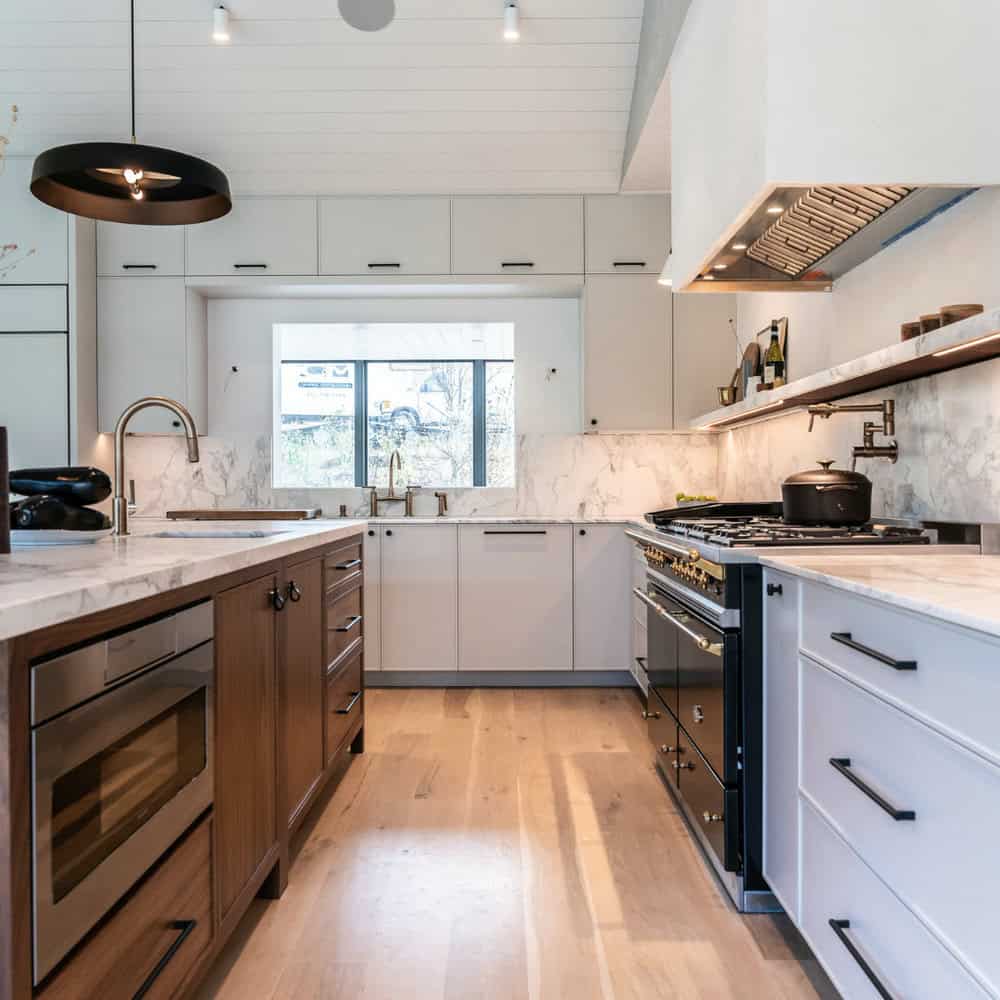 Classic floors complement white cabinets and are tied together by a marble pattern