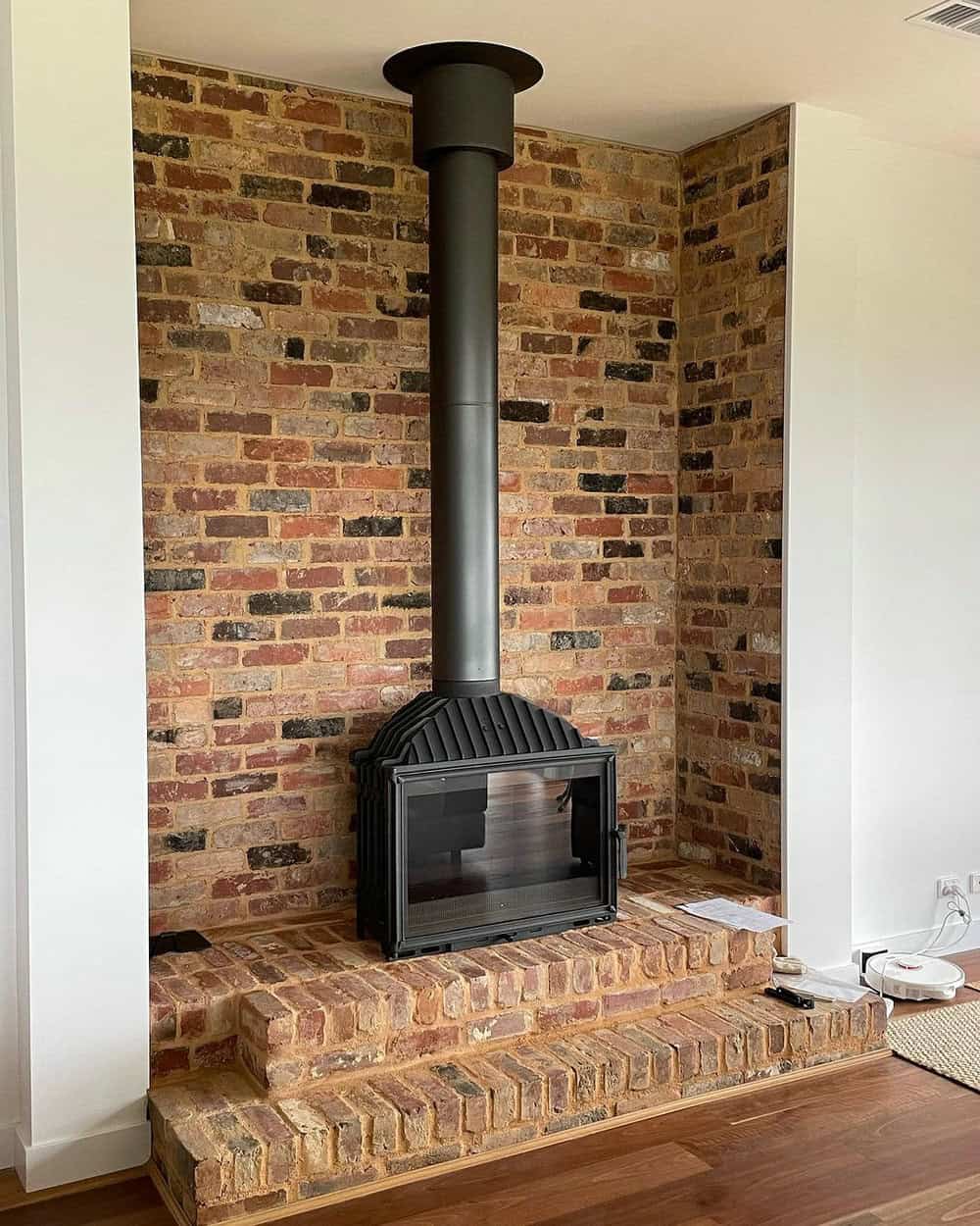 brick behind wood stove