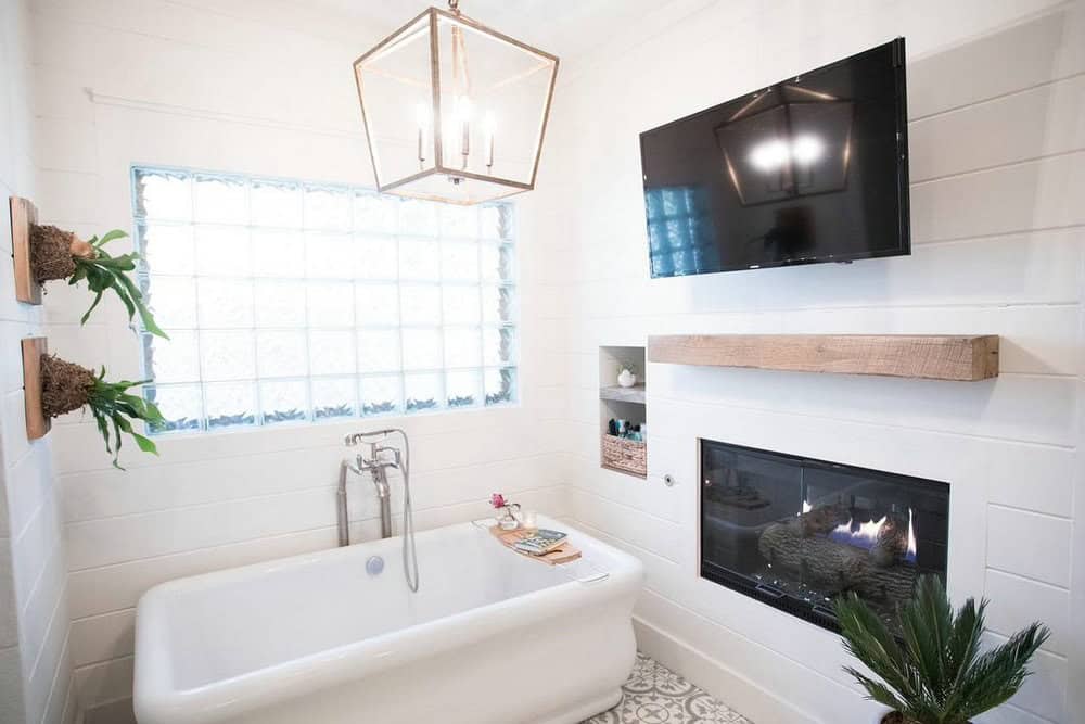 bathroom with fireplace and tv