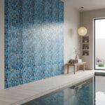 Large accent wall with blue glass tiles next to pool