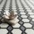 Geometric marble diamond tiles creating a luxury pattern for bathroom floors