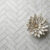 Elegant herringbone marble tile installed on a luxury bathroom floor