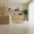 Modern kitchen featuring limestone floor tile with warm wood cabinetry