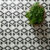 Elegant rhombus tile mosaic pattern creates a dynamic modern kitchen backsplash