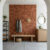 Modern terracotta tile accent wall in a minimalist entryway mudroom