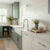 Thassos white marble hexagon tiles featuring brass accents in cottage kitchen