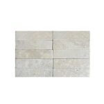 Light gray concrete tiles with a smooth, matte texture and subtle speckled pattern.