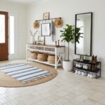 Bright entryway featuring beige textured tile flooring and natural decor accents.