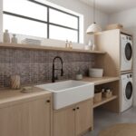 Bright laundry room with glass tile backsplash and farmhouse sink.