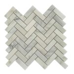 Elegant white marble herringbone tile with subtle gray veining, smooth texture, and polished finish.