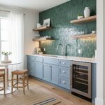 Bright blue kitchen with peel and stick tile backsplash and open wooden shelves.