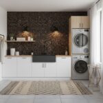 Bright laundry room with peel and stick wall tiles behind washer and dryer.