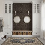 Removable peel and stick tile wall decor with two mirrors and wall sconces in a modern entryway.