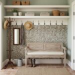 A beautiful interior featuring a seashell tile wall with mother of pearl and oyster shell accents, complemented by rustic dec.