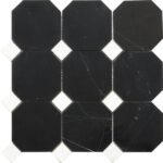 Dark black marble tiles with subtle white veining, smooth texture, and polished finish.