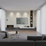Modern geometric tile wall in black and white with fireplace and mounted TV.