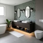 Geometric patterned wall tile in black and white, with a matte finish, used as a feature wall behind dual sinks in a modern b.