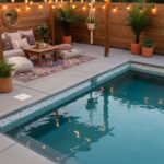 Relaxing poolside space with outdoor furniture, string lights, and potted plants for a tranquil backyard retreat.
