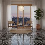 Stylish black and white geometric patterned tile floor in a contemporary living space with natural light and city view.